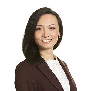 Professional woman in business attire posing for a corporate headshot